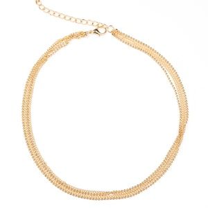 Gold choker chain with 2 sets of earrings.